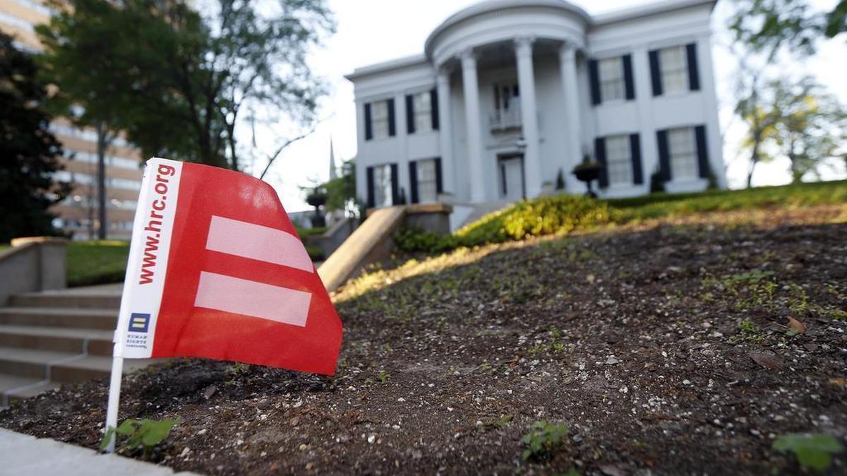 A small Human Rights Campaign equality banner flies on the grounds of the Governor's Mansion in Jackson, Miss., as several hundred people rally outside the building and called on Mississippi Gov. Phil Bryant to veto House Bill 1523, which many believe will allow discrimination against LGBT people, Monday, April 4, 2016.