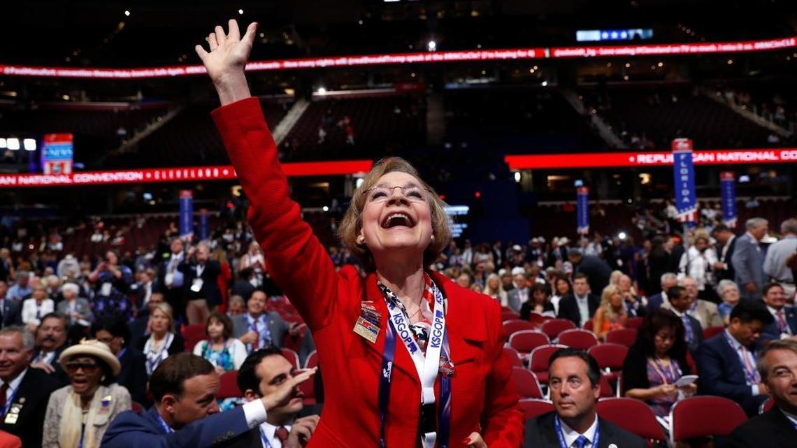 Kansas delegate Beverly Gossage celebrates as Sen. Pat Roberts, R-Kan., speaks during first day of the Republican National Convention in Cleveland on Monday, July 18, 2016.