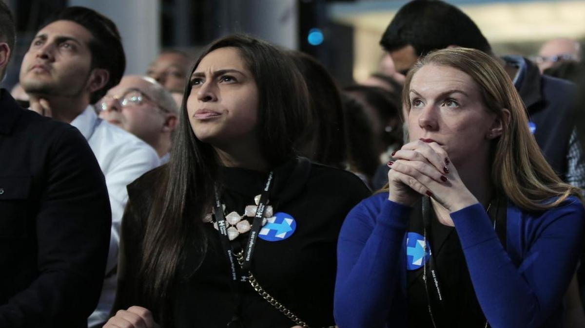 Clinton supporters listen as results continue to roll in at the Jacob B. Javits center in New York City, during Hillary Clinton's election night party on Nov. 8, 2016.