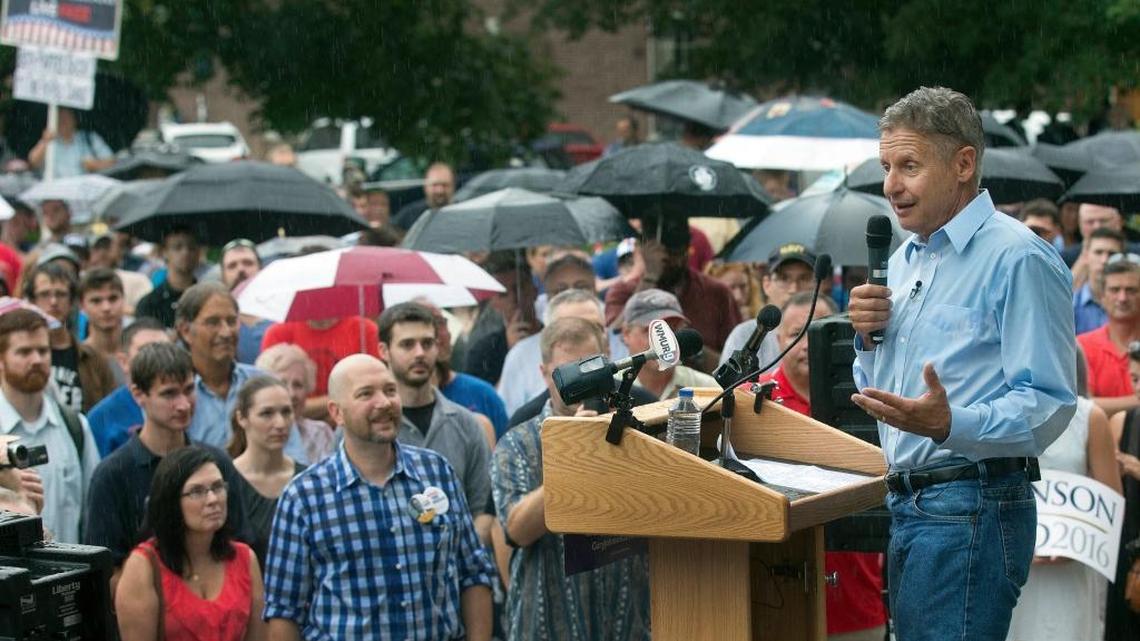 Former New Mexico governor, Libertarian presidential candidate Gary Johnson, right, speaks to a crowd of several hundred during a campaign rally in Concord, N.H., on Aug. 25, 2016.