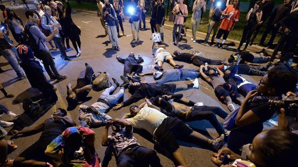 Protesters block the road in front of Bank of America Stadium in Charlotte on Thursday, Sept. 22, 2016. Will the turmoil affect the presidential election in North Carolina?