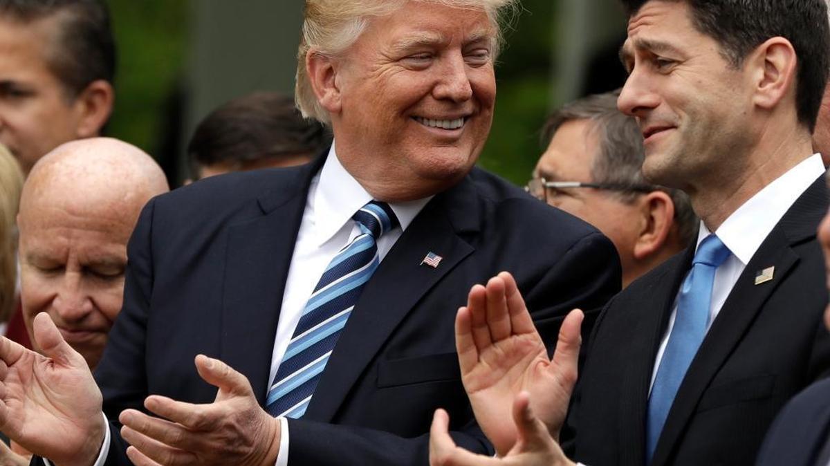 FILE - In this May 4, 2017 file photo, President Donald Trump talks to House Speaker Paul Ryan of Wis. in the Rose Garden of the White House in Washington after the House pushed through a health care bill.