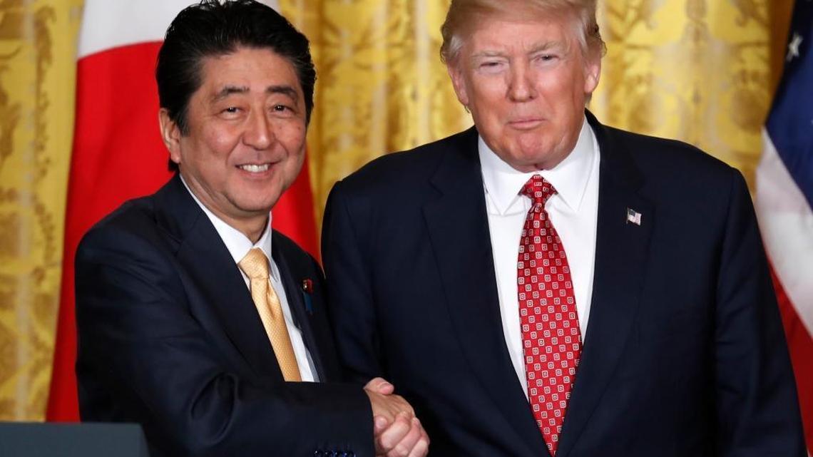 President Donald Trump and Japanese Prime Minister Shinzo Abe shakes hands following their joint news conference in the East Room of the White House in Washington, Friday, Feb. 10, 2017.