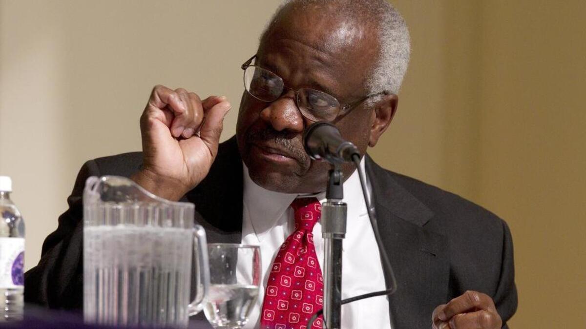 In this Jan. 26, 2012 file photo, Supreme Court Justice Clarence Thomas speaks at College of the Holy Cross in Worcester, Mass. Thomas says the Supreme Court confirmation process is an example of how the nation’s capital is “broken in some ways.” Thomas reflected Oct. 26, 2016, on his 25 years as a justice, at the Heritage Foundation, the conservative think tank where his wife once worked.