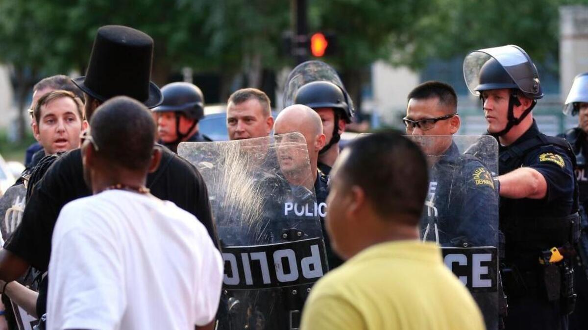 Police used shields to move protesters from the city streets during a protest in Dallas in July. The event was organized by the same activist group that organized a July 7 protest that ended with the fatal shootings of five police officers.