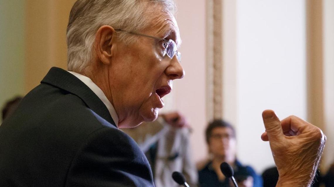 Senate Minority Leader Harry Reid, D-Nev., speaks to reporters following a closed-door Democratic policy lunch, at the Capitol in Washington on Feb. 4, 2014.