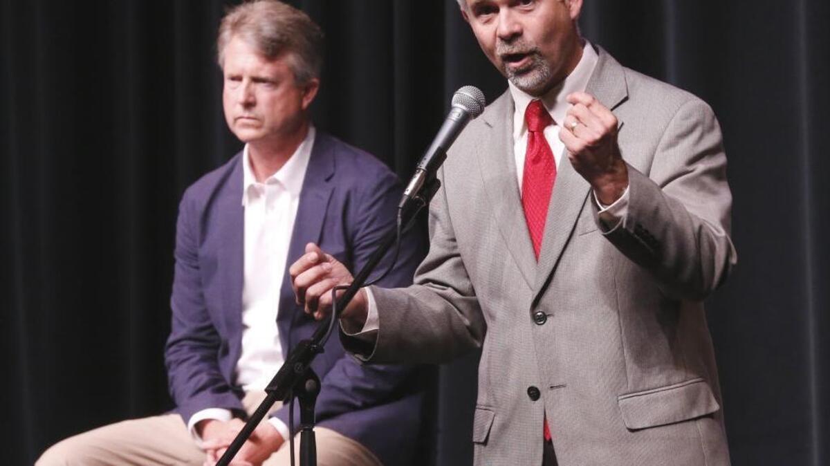 U.S. Rep. Tim Huelskamp, R-Kan., right, speaks during a debate with candidate Dr. Roger Marshall for the Kansas 1st Congressional district in Hutchinson, Kan., on Wednesday, June 27, 2016.