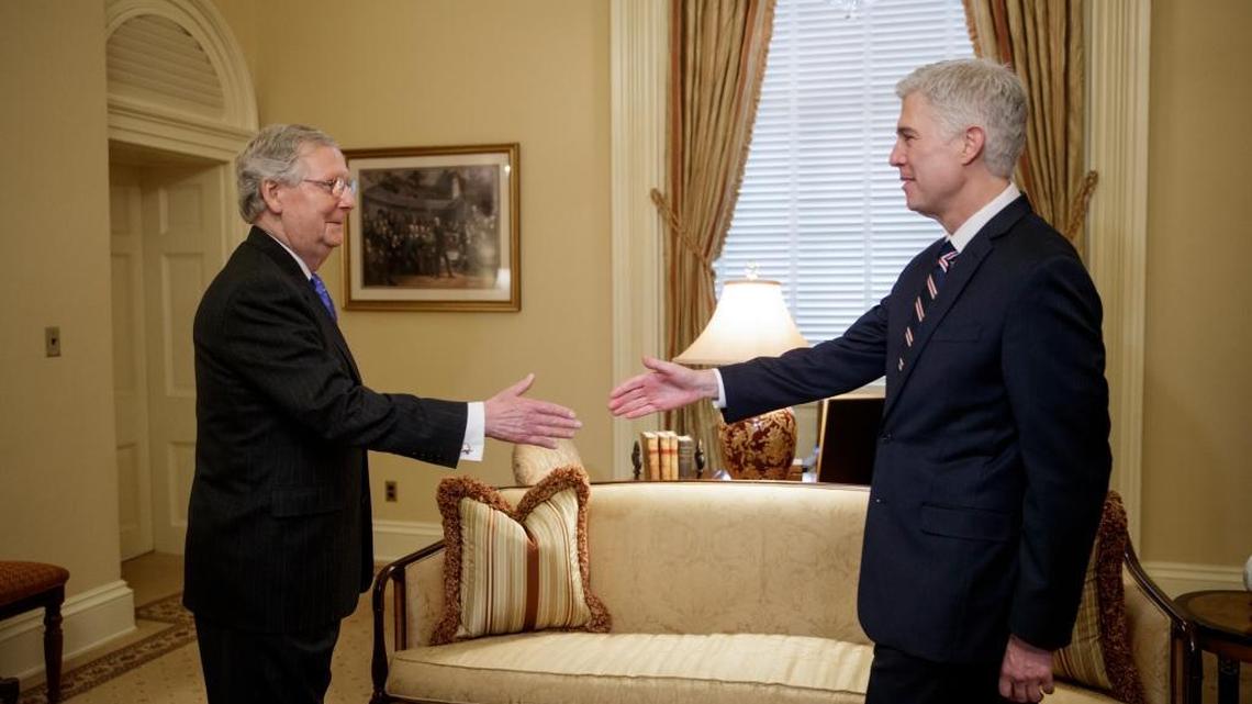 Supreme Court nominee Neil Gorsuch greets Senate Majority Leader Mitch McConnell, R-Ky., on Wednesday, Feb. 1, 2017.