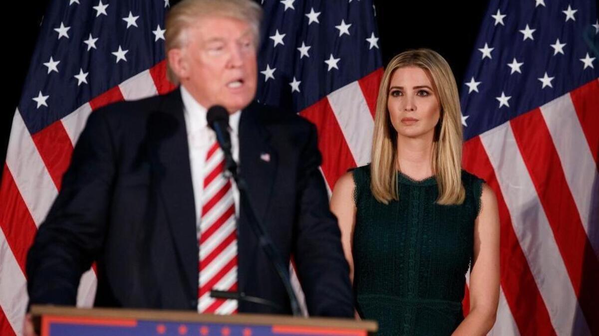 Ivanka Trump, right, looks on as her father, Republican presidential candidate Donald Trump, delivers a policy speech on child care in Pennsylvania Tuesday.