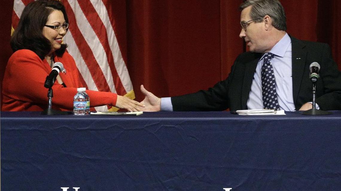 Republican U.S. Sen. Mark Kirk, right, and Democratic U.S. Rep. Tammy Duckworth, left, face off in their first televised debate in what's considered a crucial race that could determine which party controls the Senate, Thursday, Oct. 27, 2016, at the University of Illinois in Springfield, Ill.