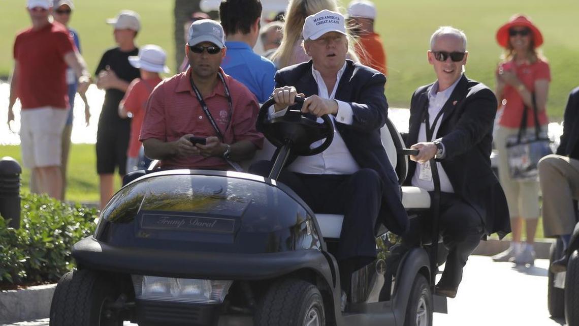 Donald Trump drives himself around the golf course to watch the final round of the Cadillac Championship golf tournament in Doral, Fla. on March 6, 2016.