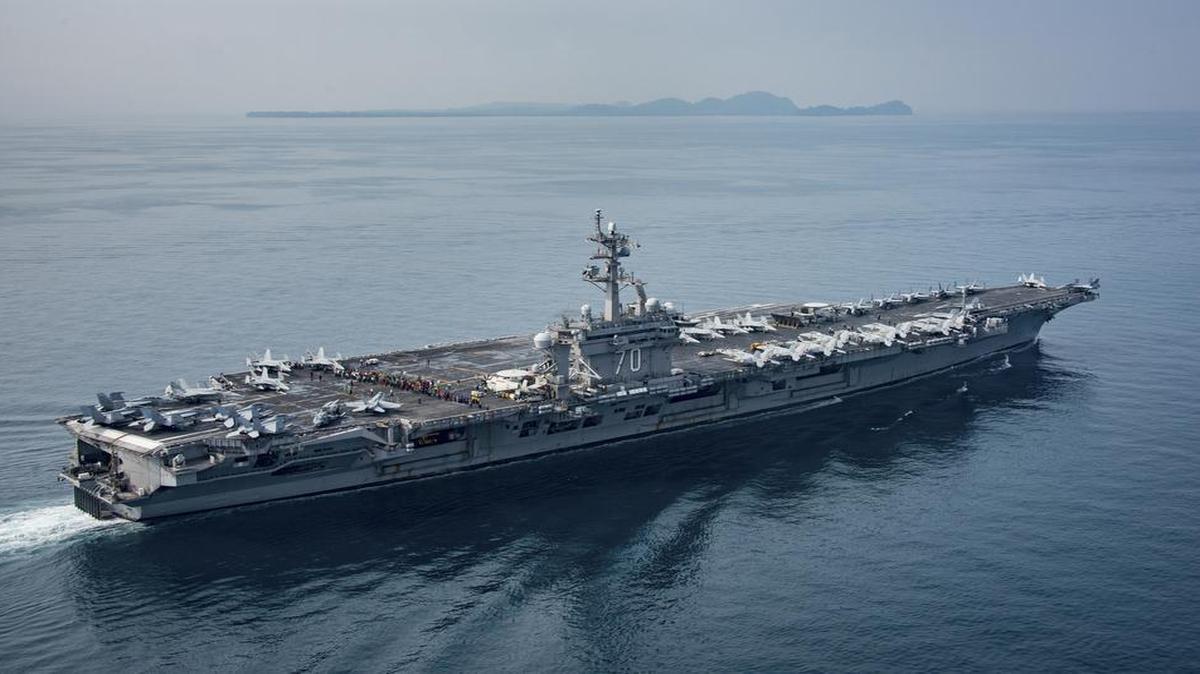 In a US Navy photo, the USS Carl Vinson, an aircraft carrier, transits the Sunda Strait, which separates the Indonesian islands of Java and Sumatra, April 15, 2017. The Carl Vinson, which the White House declared was heading to the Sea of Japan as a deterrent to North Korea, was at the time sailing in the opposite direction.