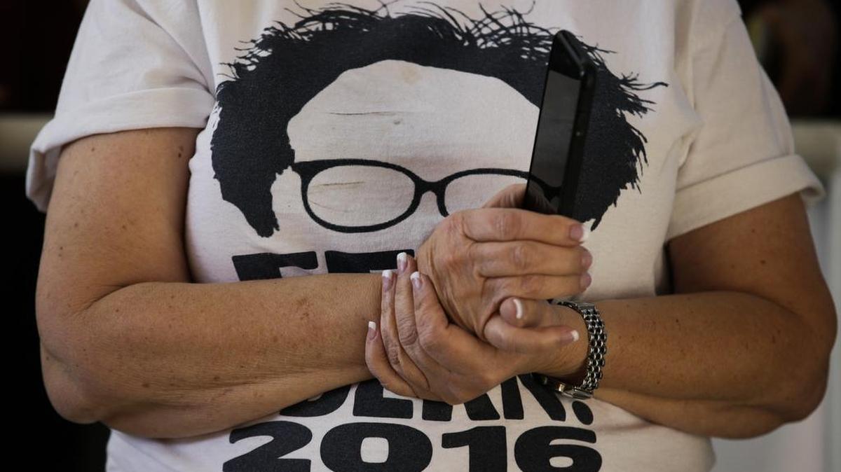 A woman wears a T-shirt supporting Democratic presidential candidate Sen. Bernie Sanders, I-Vt., while listening to the candidate at the Nevada Caucus Watch Party Feb. 20, 2016, in Henderson, Nev.