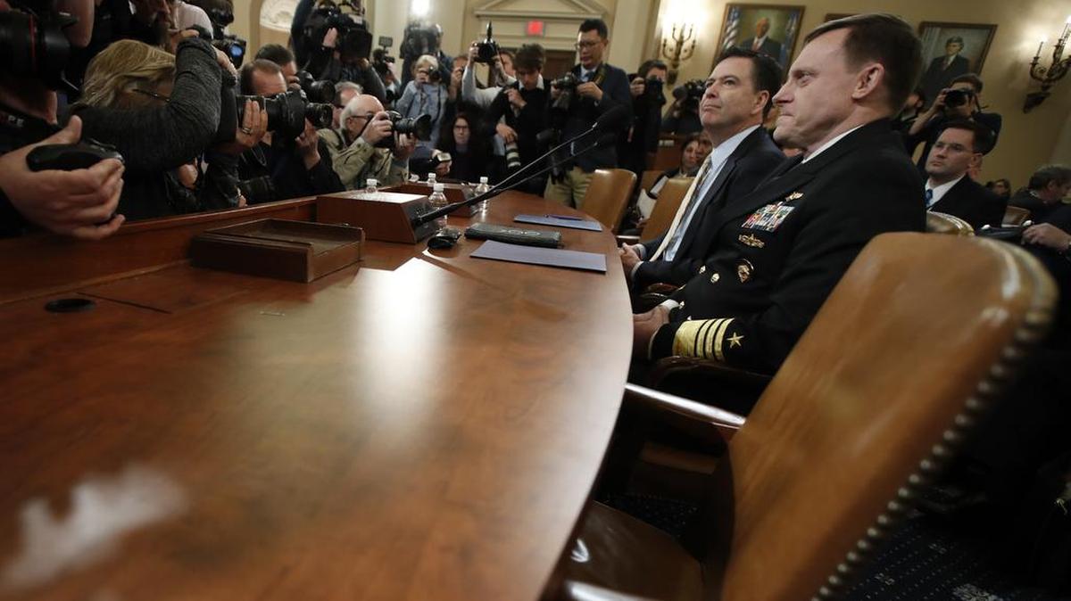 FBI Director James Comey and National Security Agency Director Michael Rogers, right, prepare to testify on Capitol Hill in Washington, Monday, March 20, 2017, before the House Intelligence Committee hearing on allegations of Russian interference in the 2016 U.S. presidential election.