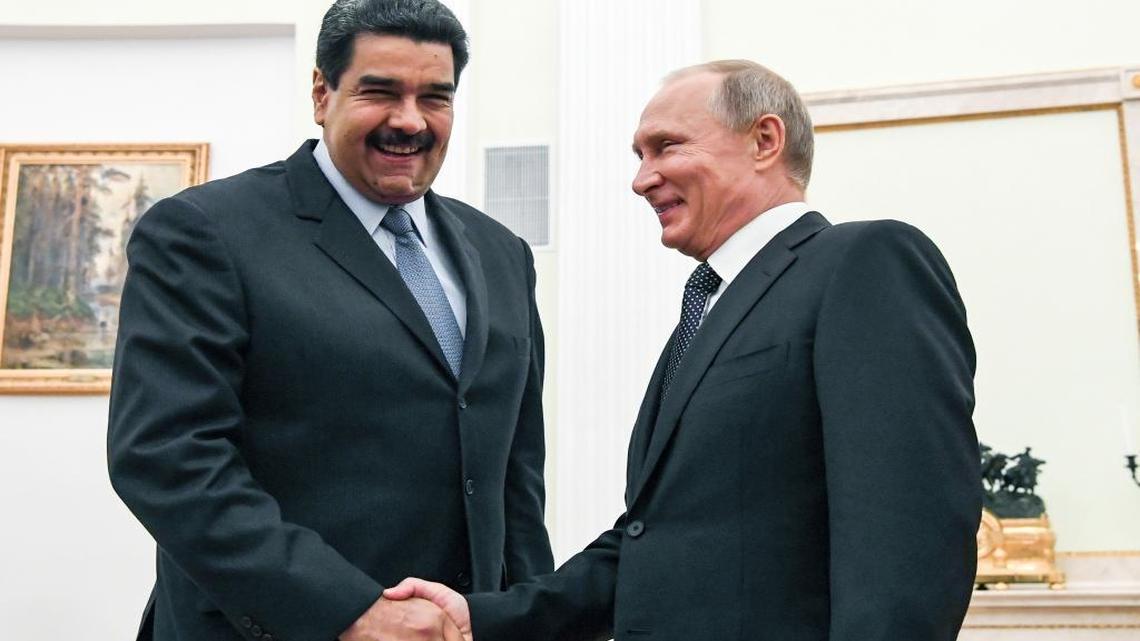 Russian President Vladimir Putin, right, shakes hands with Venezuela's President Nicolas Maduro during their meeting at the Kremlin in Moscow, Russia, Wednesday, Oct. 4, 2017.