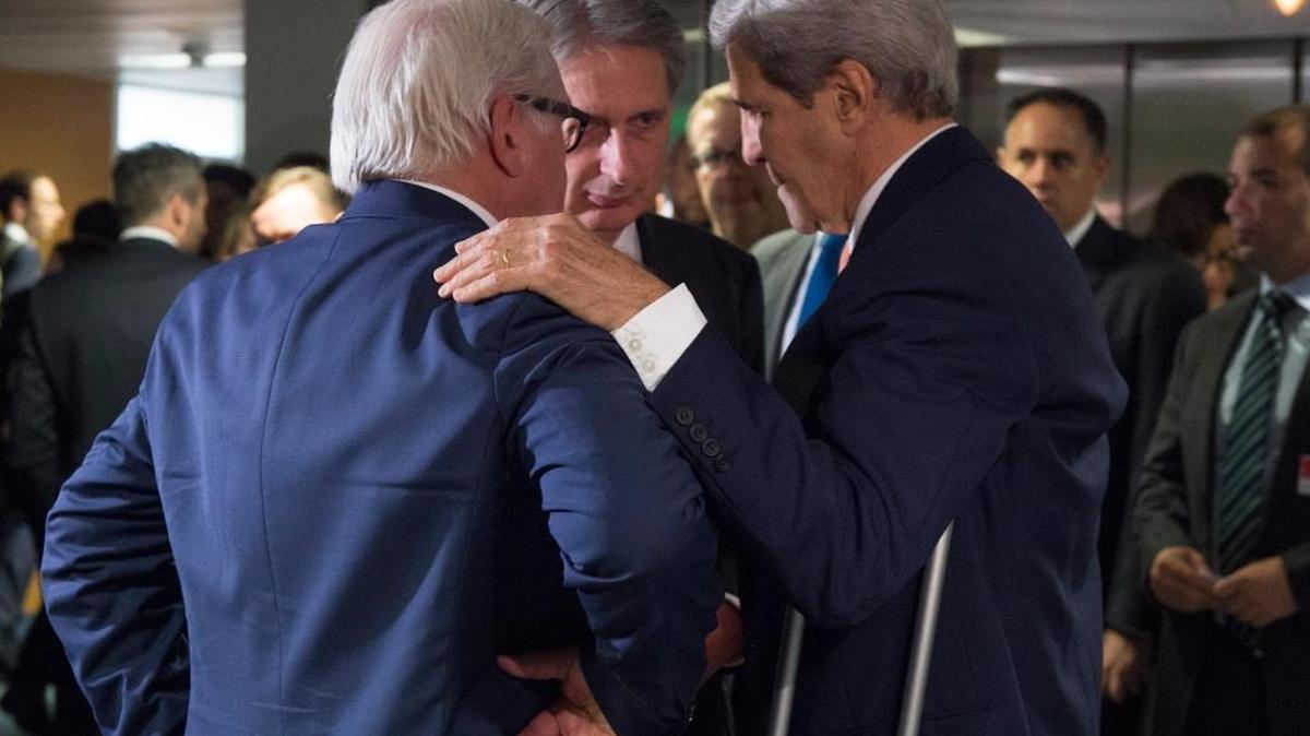 German Foreign Minister Frank-Walter Steinmeier, British Secretary of State for Foreign Affairs Philip Hammond and U.S. Secretary of State John Kerry talk prior to a plenary session at the United Nations building in Vienna, Austria, Tuesday, July 14, 2015. After 18 days of intense and often fractious negotiation, diplomats declared that world powers and Iran had struck a landmark deal to curb Iran's nuclear program in exchange for billions of dollars in relief from international sanctions, an agreement designed to avert the threat of a nuclear-armed Iran and another U.S. military intervention in the Muslim world.