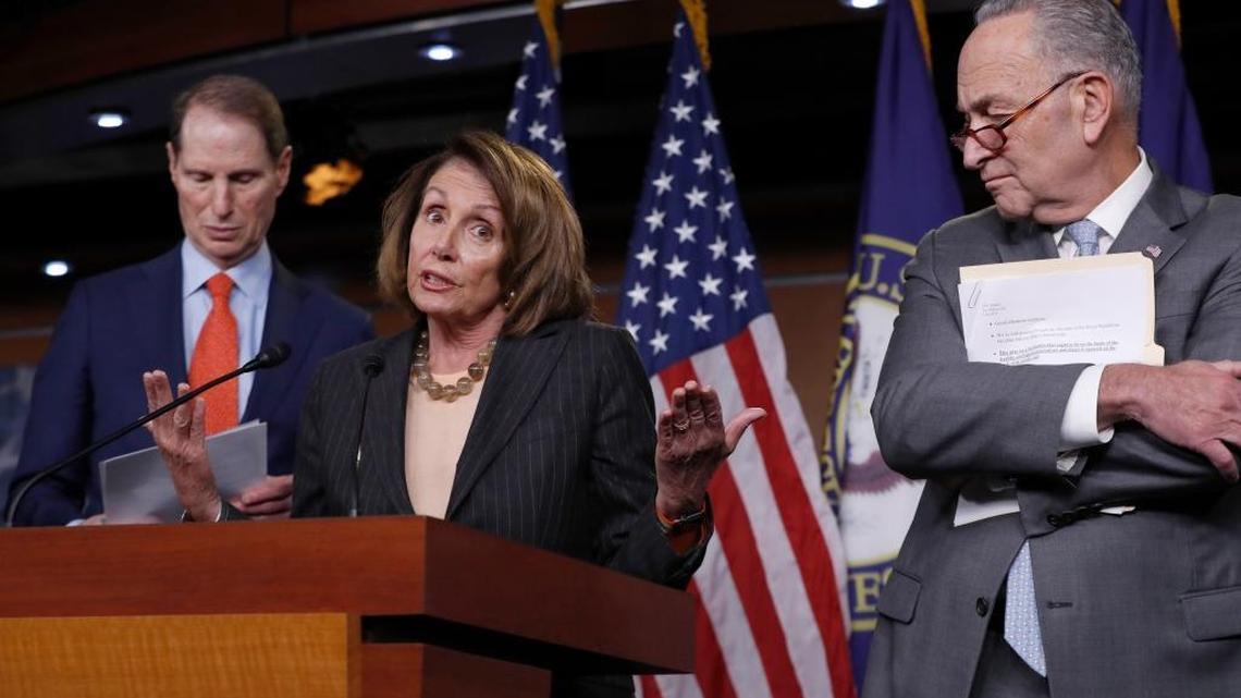 House Minority Leader Nancy Pelosi, D-Calif., flanked by Sen. Ron Wyden, D-Ore., the ranking member of the Senate Finance Committee, left, and Senate Minority Leader Chuck Schumer, D-N.Y., holds a news conference on Capitol Hill.