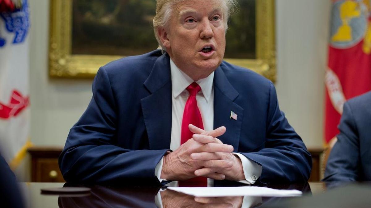 President Donald Trump accused former President Barack Obama of having Trump's telephones “wire tapped” during last year's election. Obama’s top intelligence official denied the allegation Sunday.