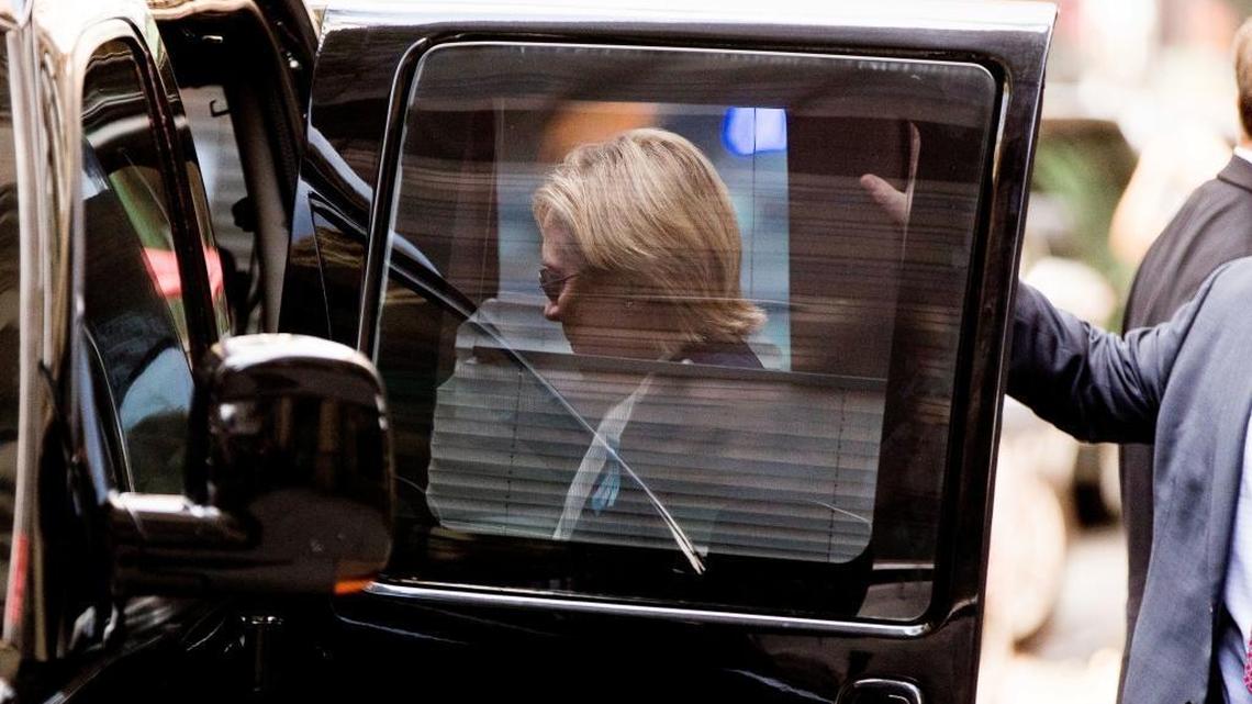 Democratic presidential candidate Hillary Clinton gets into a van as she leaves an apartment building Sunday, Sept. 11, 2016, in New York. Clinton's campaign said the Democratic presidential nominee left the 9/11 anniversary ceremony in New York early after feeling "overheated."