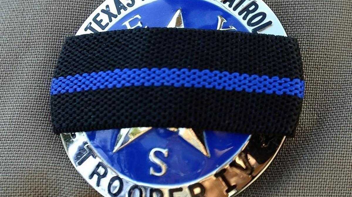 Texas troopers provide security at the shooting site in Dallas on Friday, July 8, 2016. On Thursday, 12 police officers were shot, five fatally, before police killed a gunman early Friday.