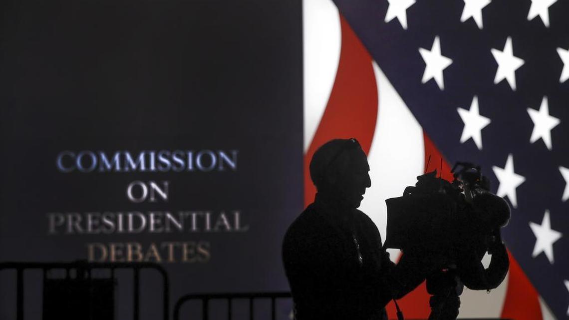 A videographer adjust his camera before the start the second presidential debate at Washington University in St. Louis, Sunday, Oct. 9, 2016.