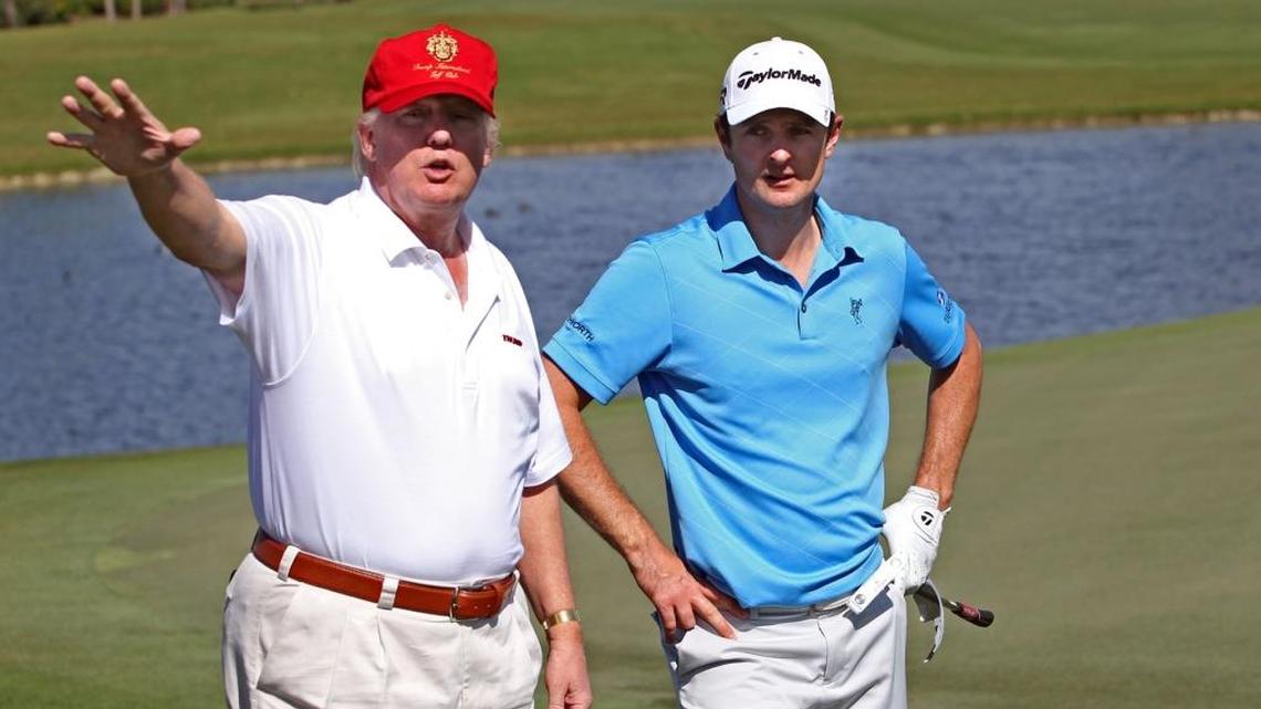 Donald Trump tells last years champion Justin Rose about his plans for the renovated golf course on the 8th green during Rose's practice round at the World Golf Championships Cadillac Championship at the Doral Golf Resort and Spa on Wednesday March 6, 2013.