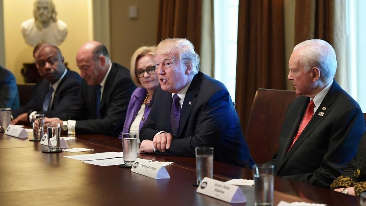 President Donald Trump, center, speaks during a meeting with members of the Senate Finance Committee and members of the President's economic team in the Cabinet Room of the White House in Washington, Wednesday, Oct. 18, 2017. Trump is joined by, from left, Sen. Tim Scott, R-S.C., White House chief economic director Gary Cohn, Sen. Claire McCaskill, D-Mo., and Senate Finance Committee Chairman Sen. Orrin Hatch, R-Utah.