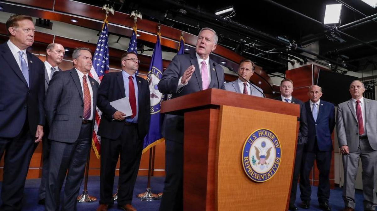 House Freedom Caucus Chairman Rep. Mark Meadows, R-N.C., center, speaks during a news conference on Capitol Hill in Washington, Wednesday, July 12, 2017, to say that his group wants to delay the traditional August recess until work is accomplished on health care, the debt ceiling and tax reform. A major GOP group is encouraging members like Meadows to stay focused on tax reform.