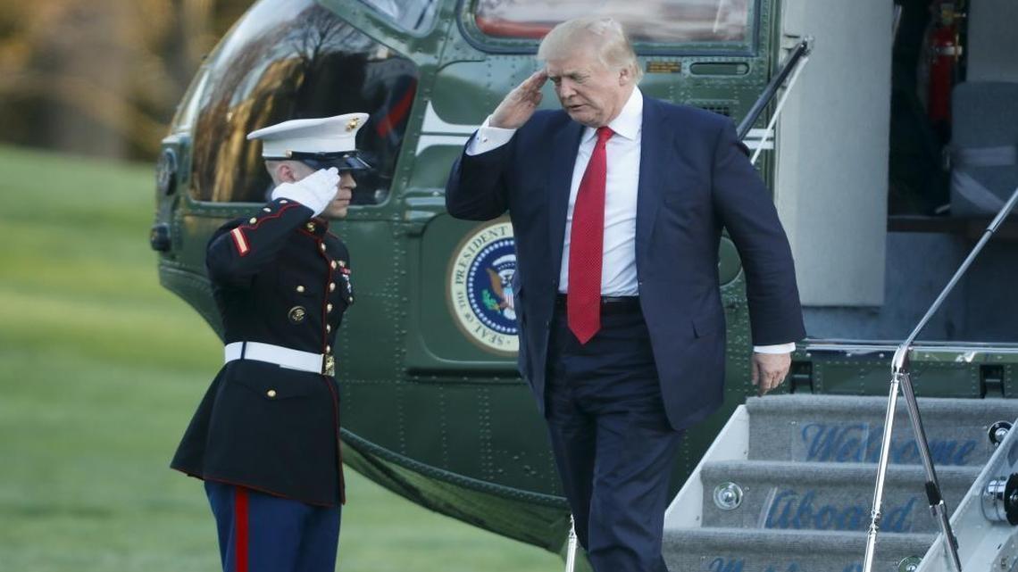 President Donald Trump salutes as he returns to the White House after a visit to his Mar-a-Lago estate last weekend. He met with two former presidents of Colombia while in Florida – a meeting that was unannounced.
