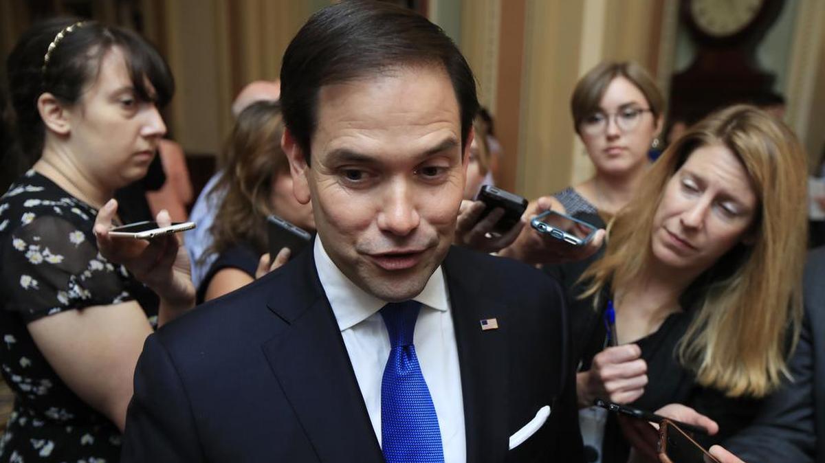 Sen. Marco Rubio, R-Fla. speaks to reporters as he walks toward the Senate floor on Capitol Hill.