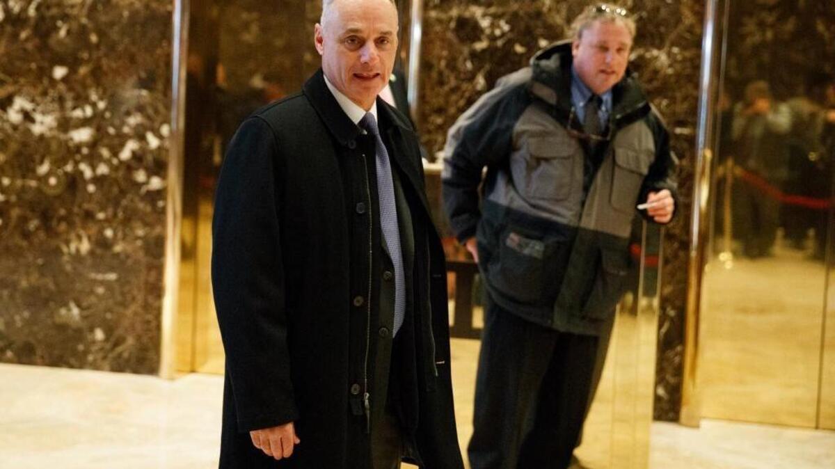 Major League Baseball Commissioner Rob Manfred, left, and New York Yankees President Randy Levine arrive at Trump Tower in New York, Tuesday, Jan. 10, 2017, for a meeting with President-elect Donald Trump.