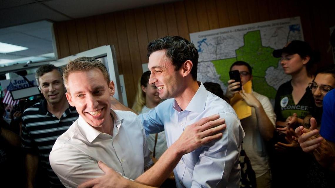 Jason Kander, left, former Missouri Secretary of State, campaigns for Jon Ossoff, Democratic candidate for Georgia's 6th congressional district, right, during a stop at Ossoff's campaign office in Chamblee, Ga., Monday, June 19, 2017.