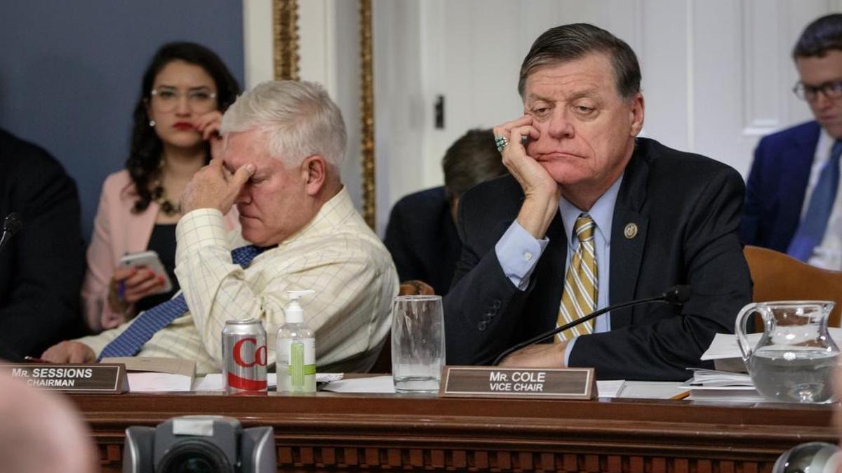 After eight hours of debate, House Rules Committee Chairman Pete Sessions, R-Texas, left, and Rep. Tom Cole, R-Okla., the vice chair, listen to arguments from committee chairs as the panel meets to shape the final version of the Republican health care bill before it goes to the floor for debate and a vote, March 22, 2017, on Capitol Hill in Washington.