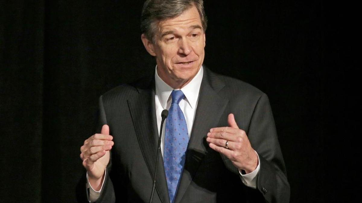 In this June 24, 2016, file photo, North Carolina Attorney General Roy Cooper speaks during a forum in Charlotte, N.C. Cooper, North Carolina's next Democratic governor, has vowed to keep his campaign promises to bend back the rightward course of the state. But with only a 10,000-vote victory over GOP Gov. Pat McCrory and bitter partisan distrust in this deeply divided state, he’s already slipped along the rocky path he must walk to work successfully with the Legislature. And Republicans will maintain veto-proof majorities in 2017.