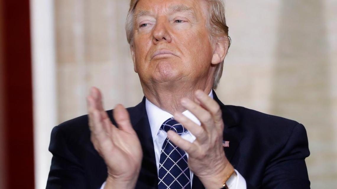 President Donald Trump applauds on Capitol Hill in Washington, Tuesday, April 25, 2017, during the U.S. Holocaust Memorial Museum's National Days of Remembrance ceremony.