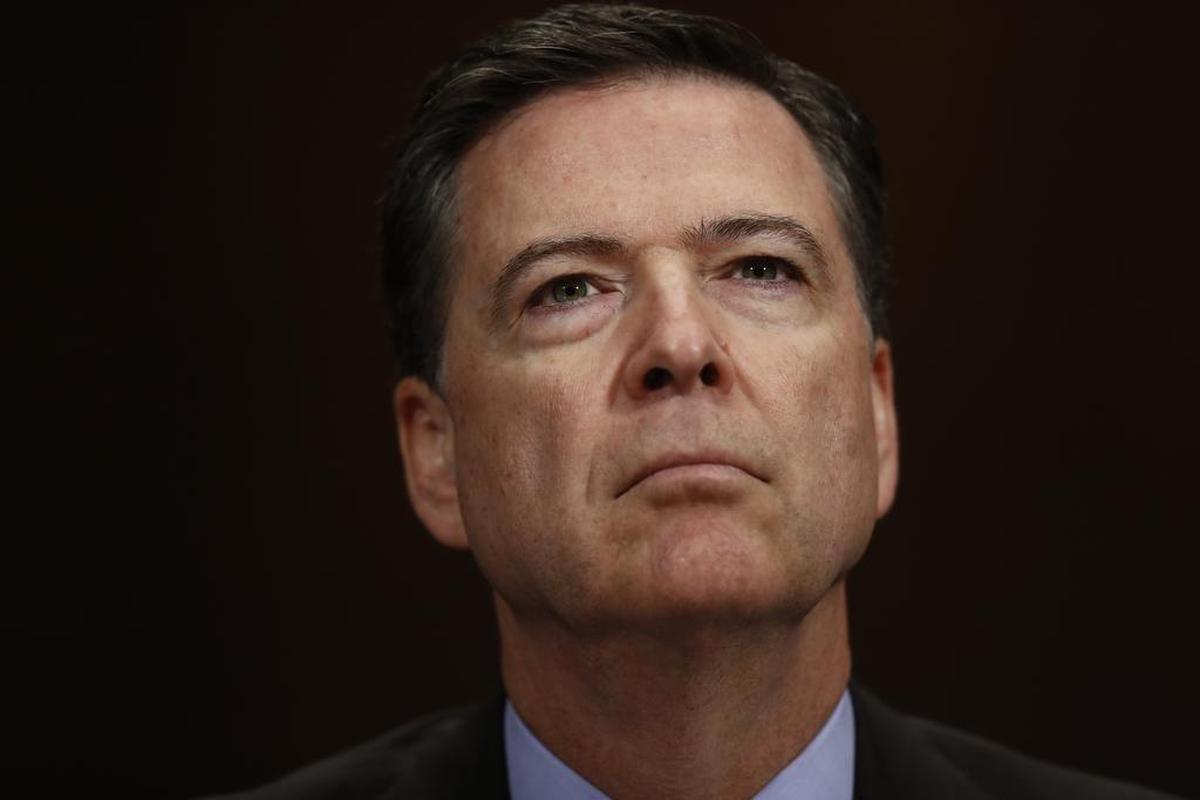 FILE- In this May 3, 2017, file photo, FBI Director James Comey listens on Capitol Hill in Washington.