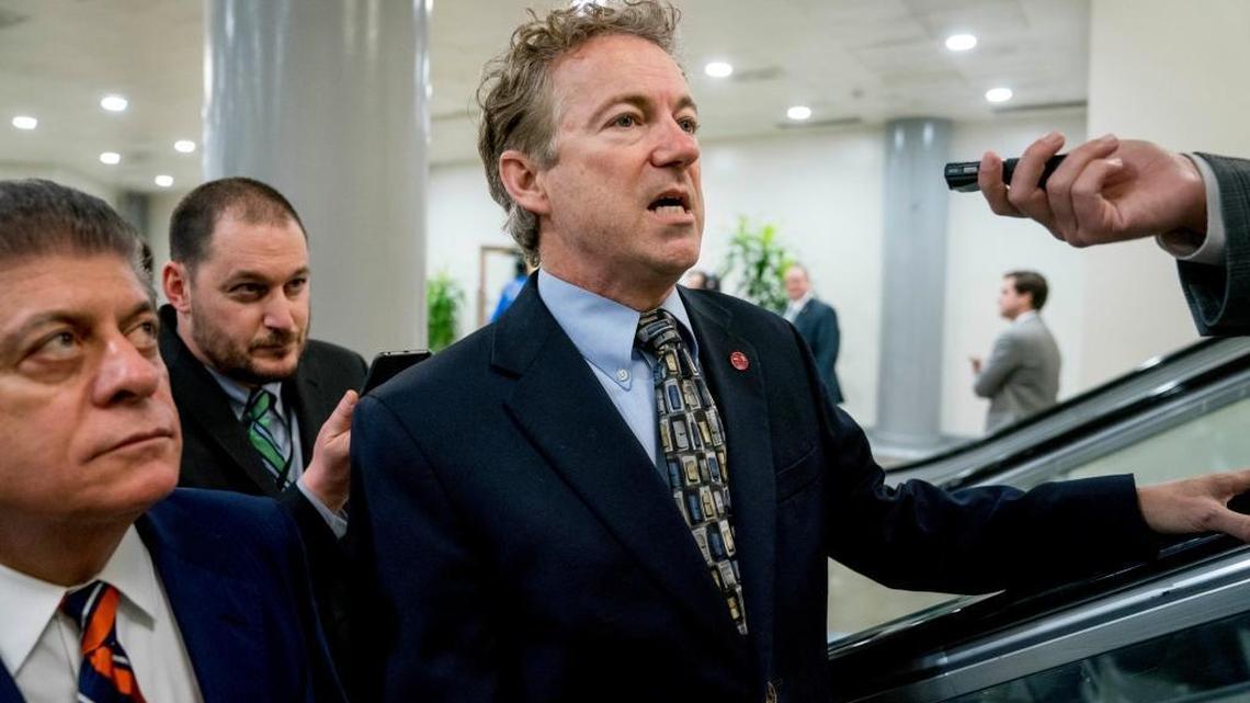Sen. Rand Paul, R-Ky., speaks to reporters as he walks towards the Senate as Congress moves closer to the funding deadline to avoid a government shutdown on Capitol Hill in Washington Thursday.