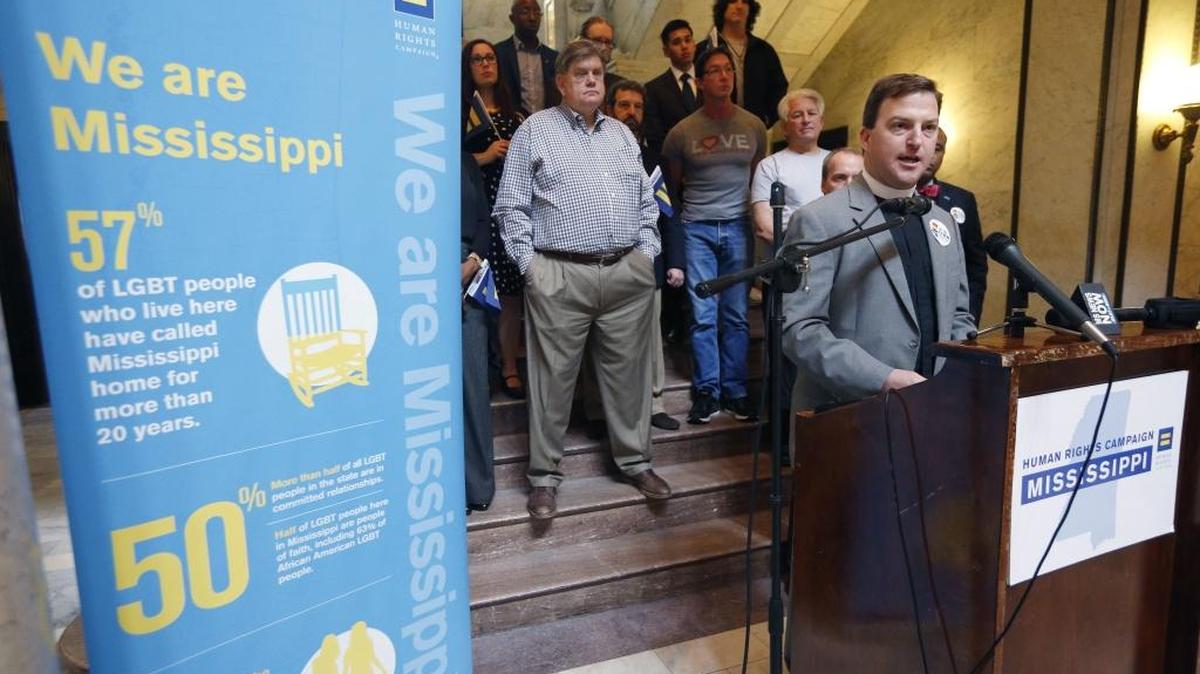 Rev. Chris Donald, a Methodist chaplain at Millsaps College, joins other human rights advocates in calling for the defeat of what they believe is a discriminatory anti-LGBT bill at the Capitol in Jackson, Miss., March 23, 2016.