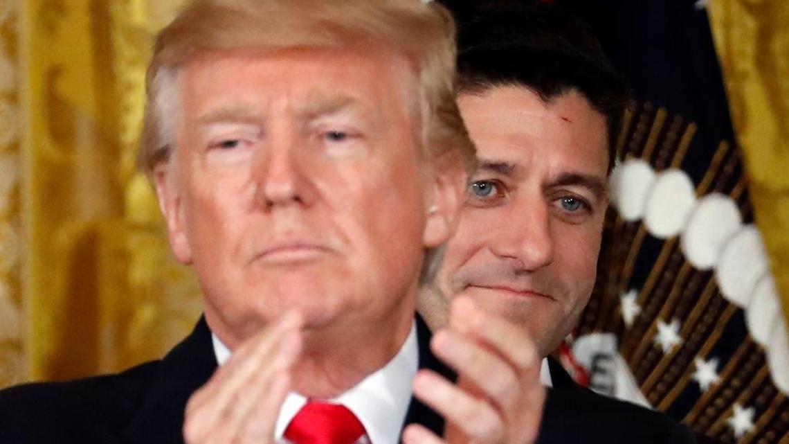 President Donald Trump applauds with House Speaker Paul Ryan of Wis., behind him in the East Room of the White House, Wednesday, July 26, 2017, in Washington. House Republicans, hoping to defend their majority, are targeting Democras on national security in a new ad buy.