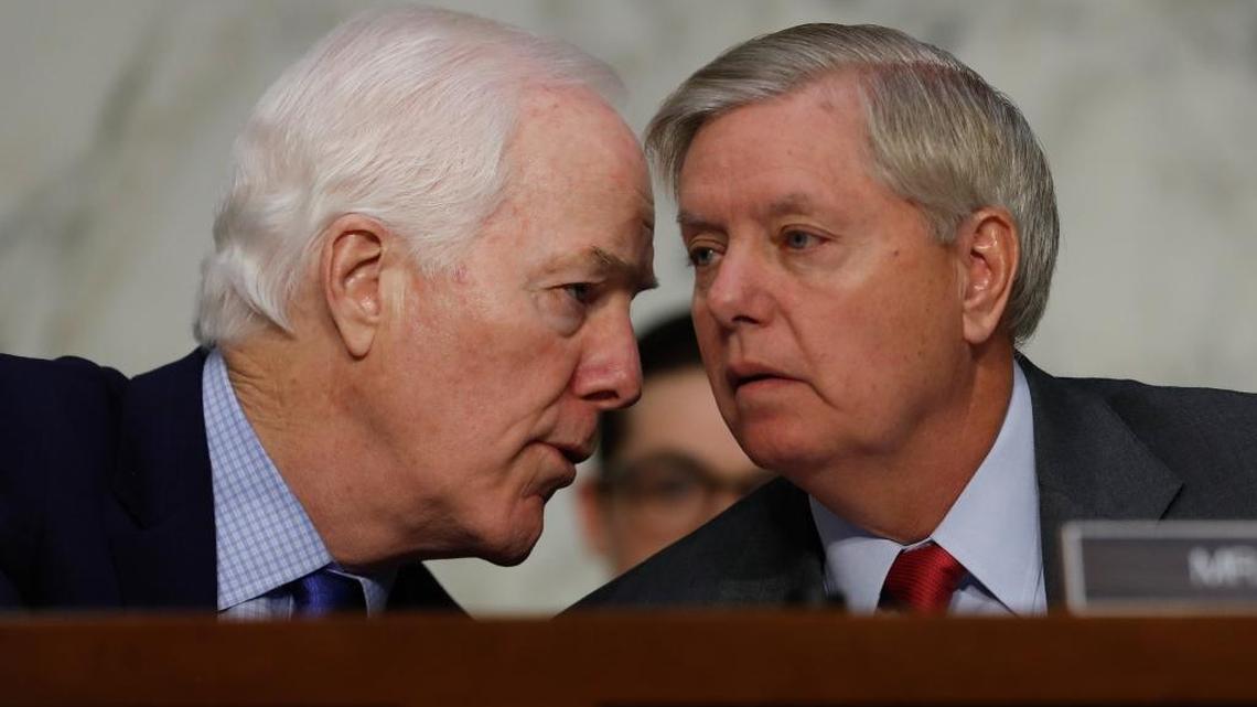 Senate Judiciary subcommittee on Crime and Terrorism Chairman Sen. Lindsey Graham, R-S.C., right, talks with Senate Majority Whip John Cornyn of Texas on Capitol Hill in Washington, Monday, May 8, 2017, during subcommittee's hearing: "Russian Interference in the 2016 United States Election."