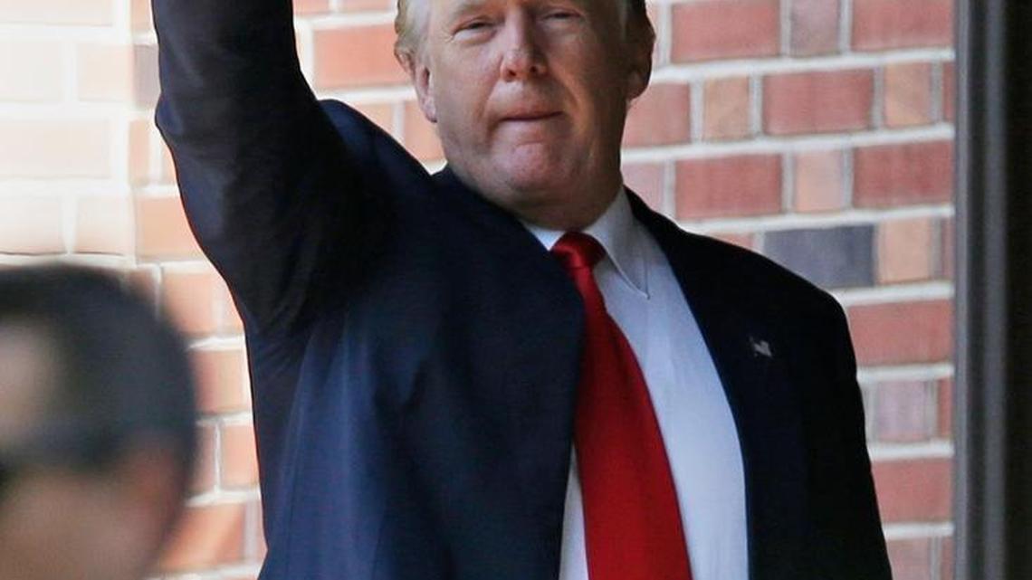 Republican presidential candidate Donald Trump waves as he leaves the residence of Indiana Gov. Mike Pence in Indianapolis, Wednesday, July 13, 2016.