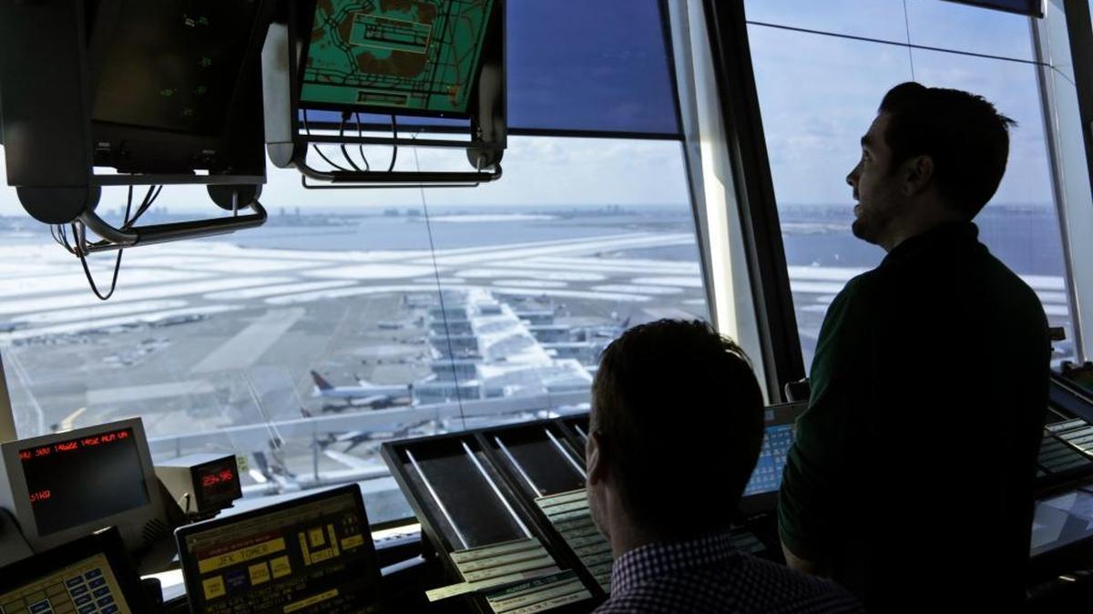 Air traffic controllers work in the tower at John F. Kennedy International Airport in New York, March 16, 2017. President Donald Trump is calling for privatizing the nation’s air traffic control operations in his budget proposal, a top priority of the airline industry.