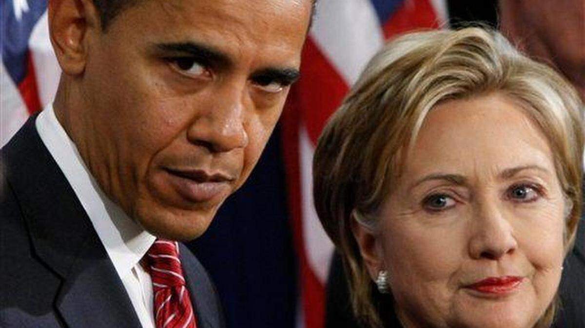 In this Dec. 1, 2008, file photo, President-elect Barack Obama stands with Sen. Hillary Clinton, D-N.Y., after announcing that she is his choice as secretary of state during a news conference in Chicago.