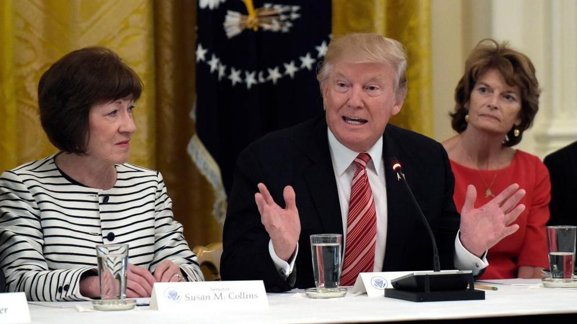 President Donald Trump, center, speaks as he meets with Republican senators on health care in the East Room of the White House in Washington, Tuesday, June 27, 2017. Sen. Susan Collins, R-Maine, left, and Sen. Lisa Murkowski, R-Alaska, right, listen