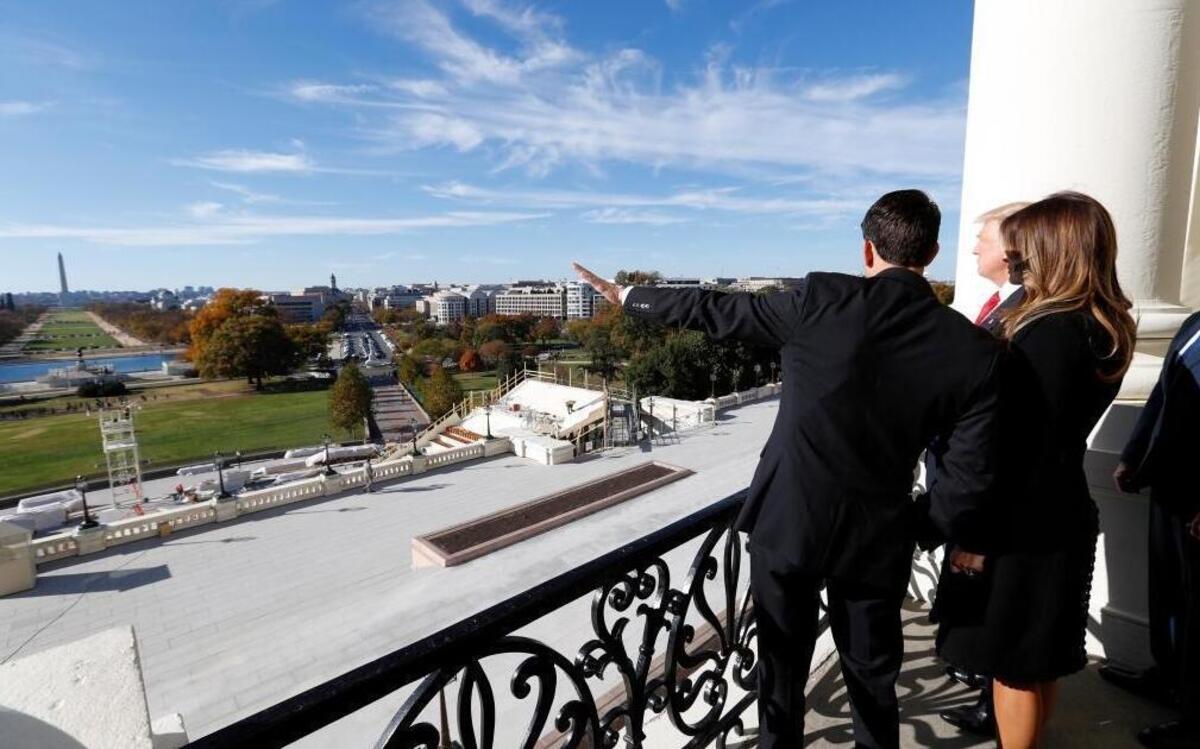 House Speaker Paul Ryan of Wis., left, shows President-elect Donald Trump, and his wife Melania the view of the inaugural stand that is being built and Pennsylvania Avenue, from the Speaker's Balcony on Capitol Hill in Washington, Thursday, Nov. 10, 2016.
