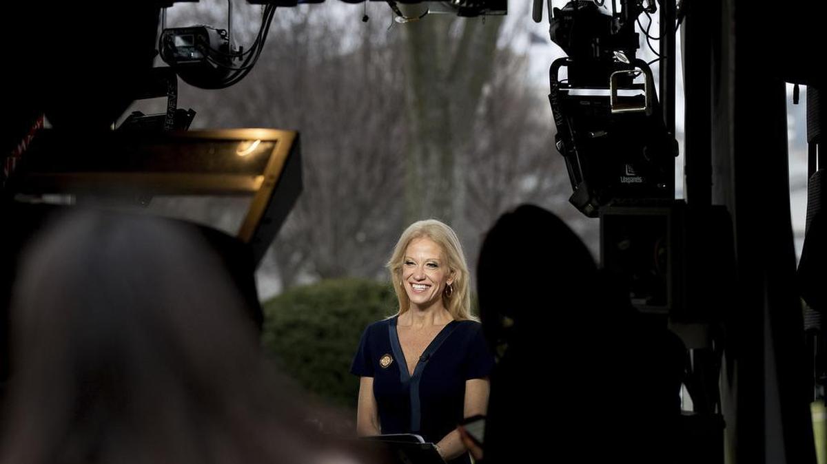 President Donald Trump's adviser Kellyanne Conway gets ready to speak on television outside the White House, Sunday, Jan. 22, 2017, in Washington.
