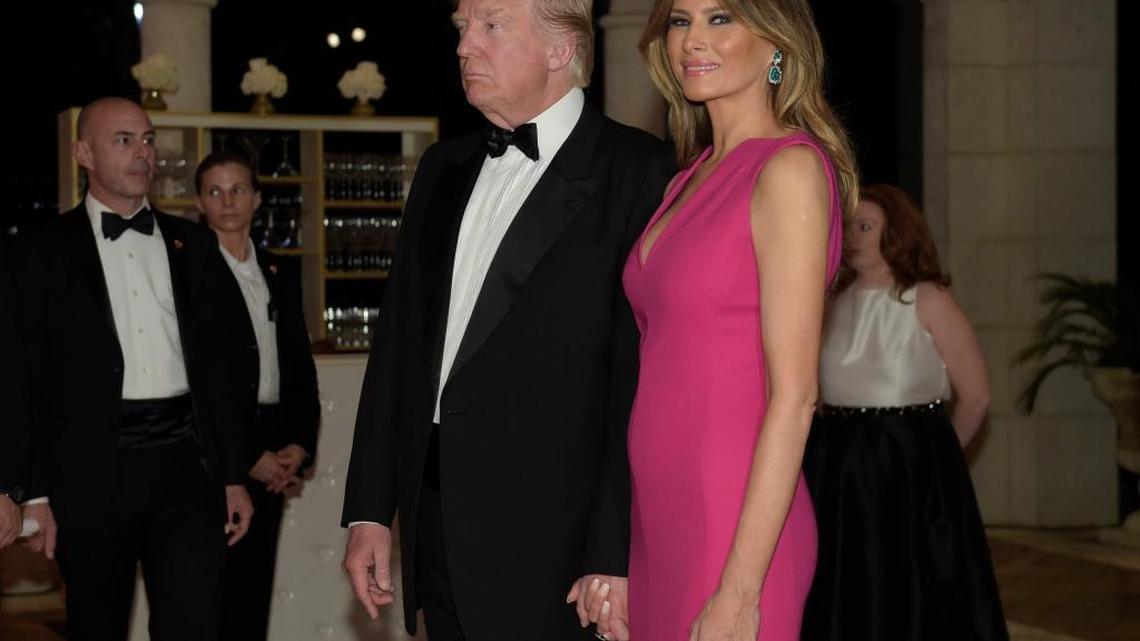 President Donald Trump and first lady Melania Trump arrive for the 60th annual Red Cross Gala at Trump's Mar-a-Lago resort in Palm Beach, Fla., on Saturday, Feb. 4, 2017.