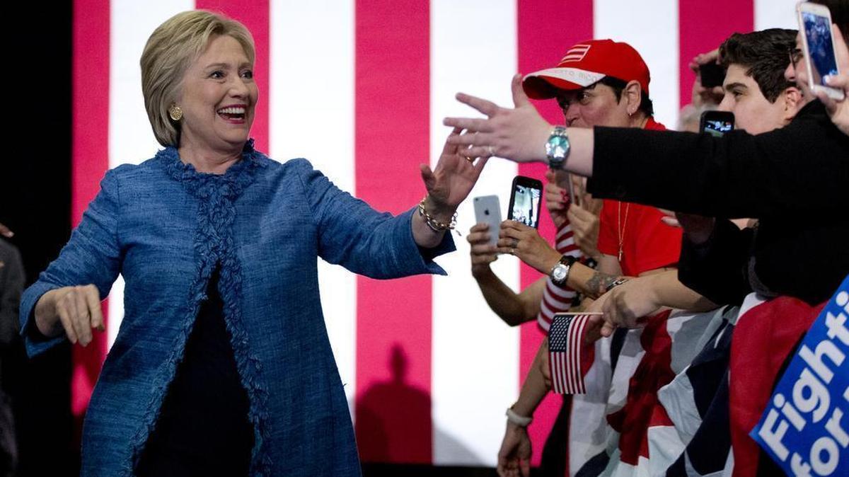 Democratic presidential candidate Hillary Clinton arrives to a cheering crowd at an election night event at the Palm Beach County Convention Center in West Palm Beach, Fla., on Tuesday. Bernie Sanders said Thursday he will not seek a recount of results in Missouri’s Democratic presidential primary, conceding defeat to Clinton.