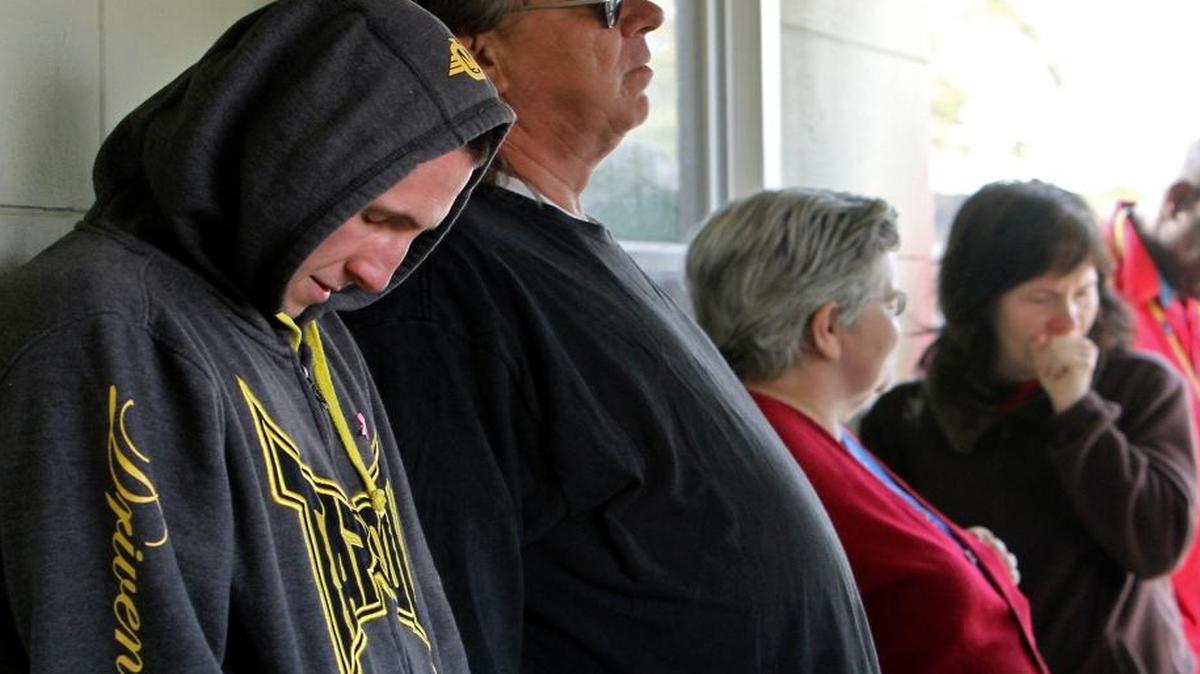 Coast residents seeking medical care wait in line outside of Bethel Free Health Clinic in Biloxi, Mississippi in 2013. The clinic provided services for those that are uninsured or underinsured.