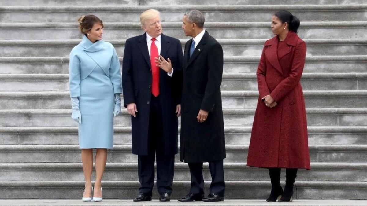 FILE - In this Friday, Jan. 20, 2017 file photo, from left, first lady Melania Trump, President Donald Trump, former president Barack Obama and Michelle Obama stand on the steps of the U.S. Capitol in Washington, after Trump's inauguration ceremony. On Tuesday, Feb. 20, 2018, The Associated Press has found that stories circulating on the internet that Trump canceled federal funding for former President Obamaâ€™s library are untrue. Private donations are paying for the libraryâ€™s construction and it wonâ€™t be part of a network of presidential libraries administered by the National Archives.